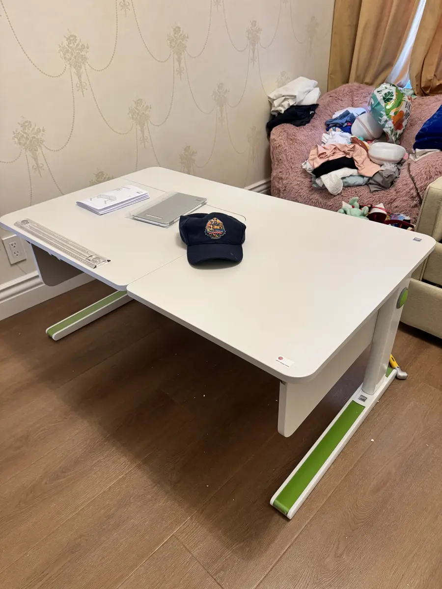 Height-adjustable kids study desk assembled in Orange County