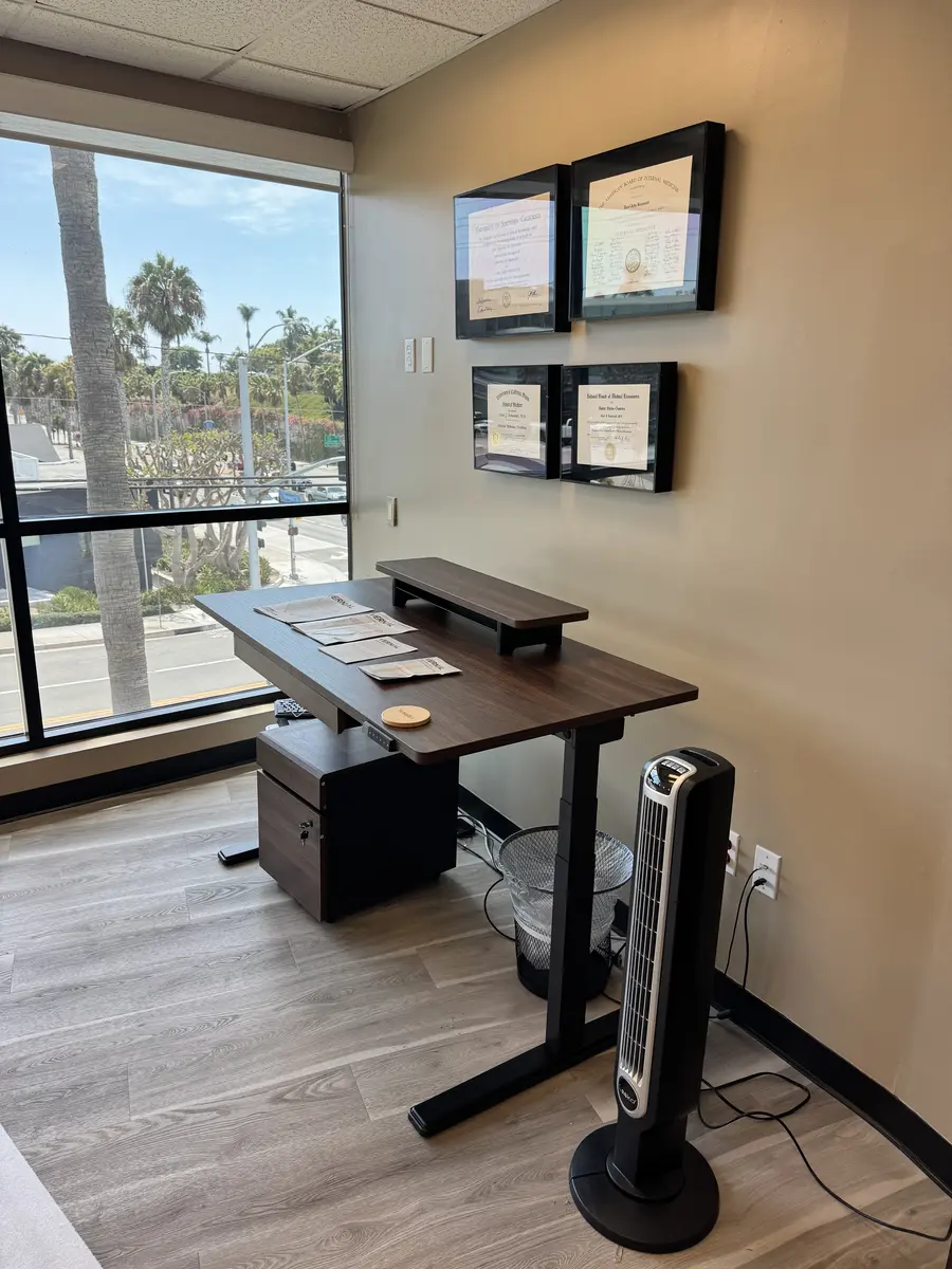 Adjustable standing desk assembled in a Newport Beach office, August 2026