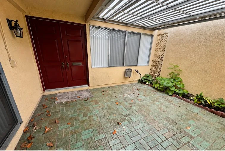 Dirty patio tile before cleaning