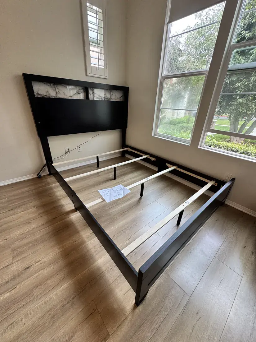Bed frame with marble-look headboard assembled in Irvine, October 2026