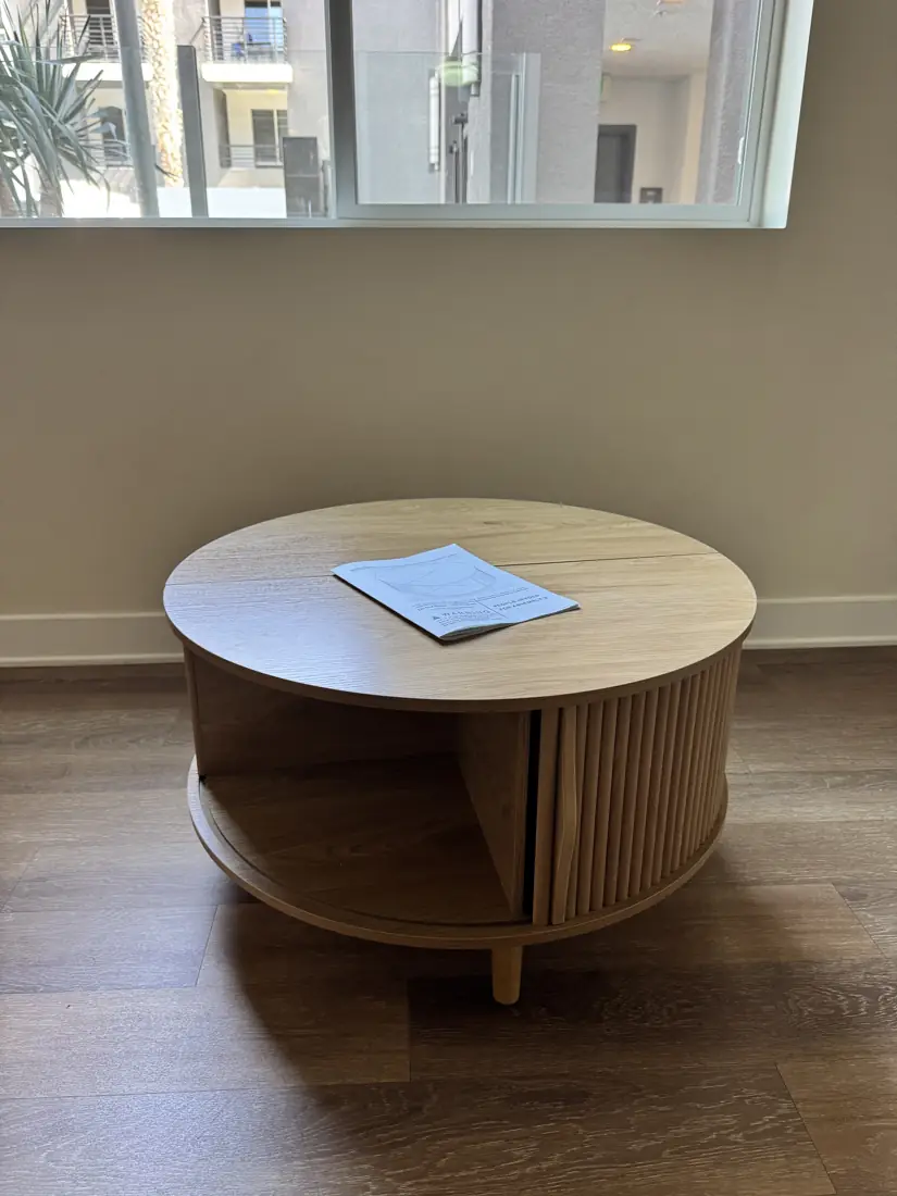 Round tambour-door coffee table assembled in Irvine, September 2026