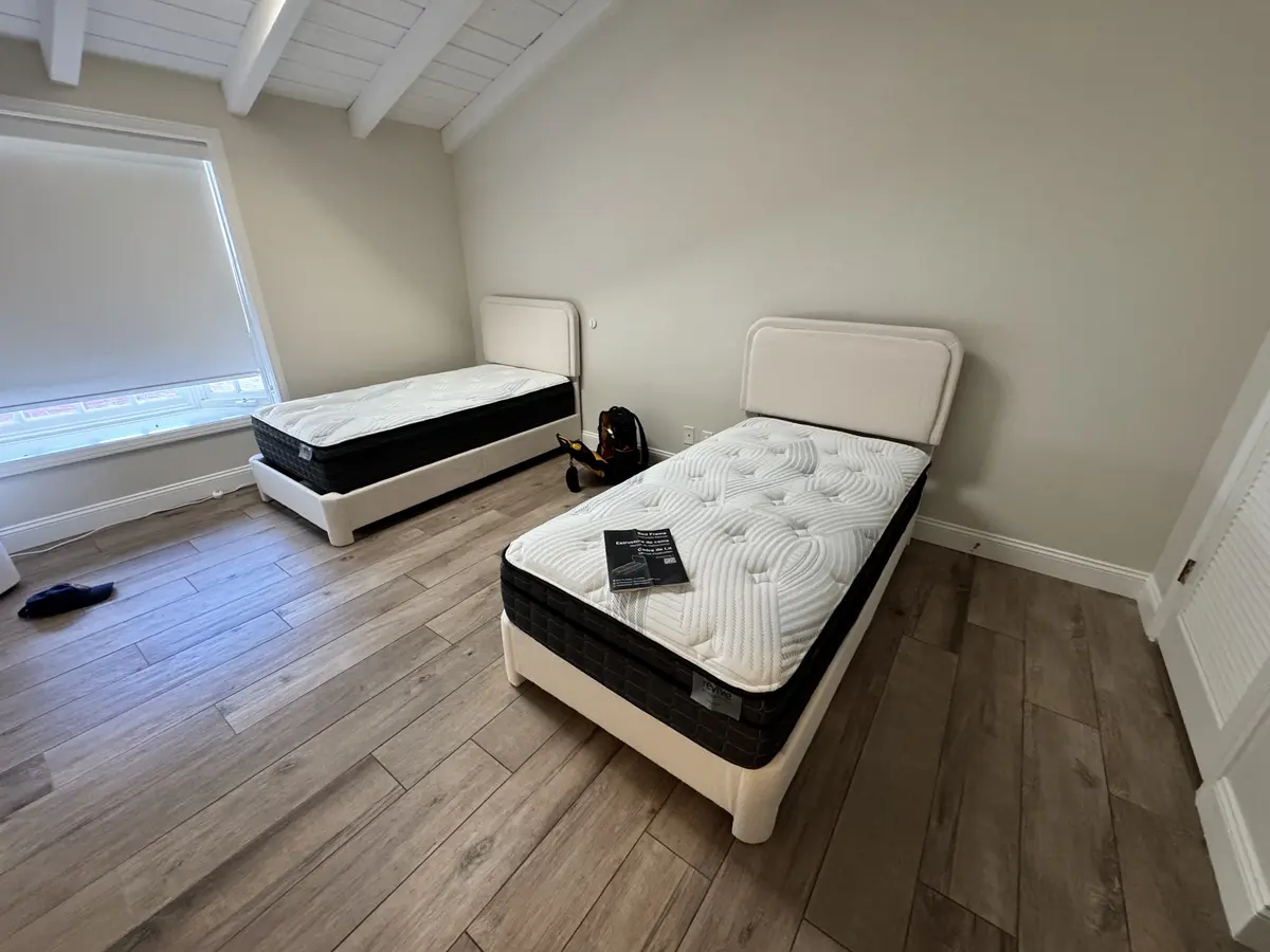 Two upholstered twin bed frames assembled in Corona del Mar, September 2026