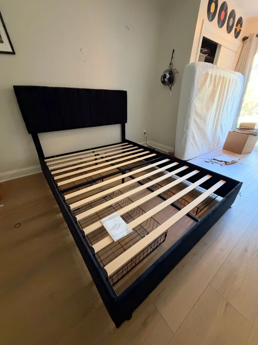 Upholstered bed frame with under-bed storage baskets assembled in San Juan Capistrano, October 2026