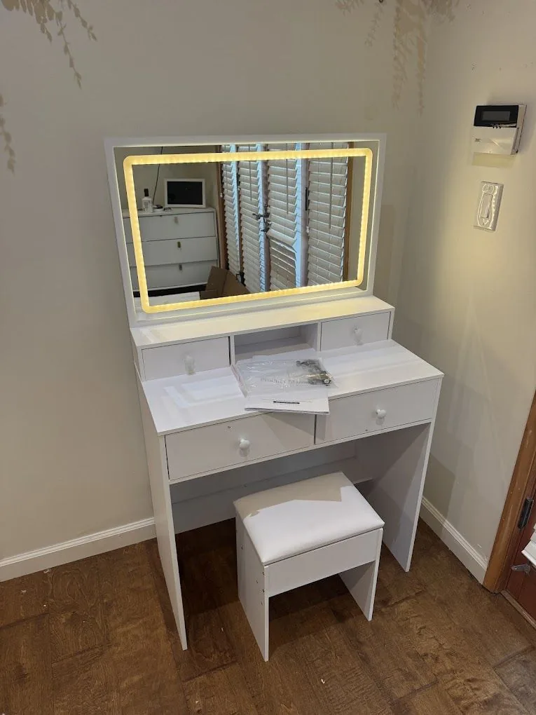 Vanity with lighted mirror